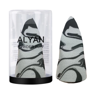Macro detail of marble pattern makeup sponge with a transparent storage cylinder case