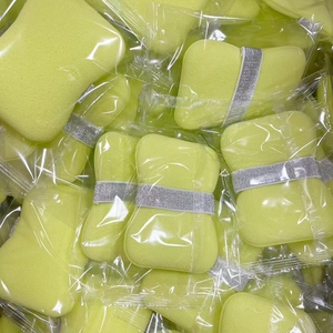 Macro detail of fluorescent yellow exfoliating sponge with sparkling glitter ribbon band
