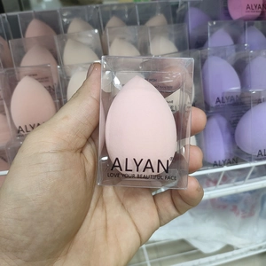 Pink teardrop beauty blender in a transparent gift box for dry and wet makeup use