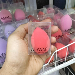 Detailed view of teardrop makeup sponge in clear packaging for seamless blending