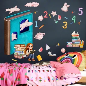 Child reading on giant book wall sticker with rainbow and cloud decor for kids room