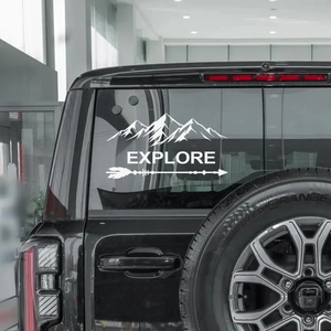 Mountain peaks and explore arrow car decal sticker applied on rear window of a black SUV