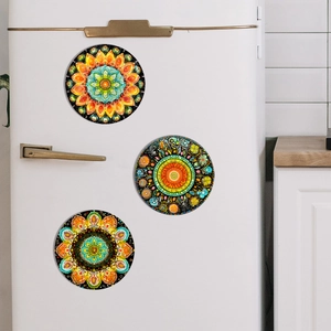 Three colorful mandala pattern round magnetic fridge magnets set on a white surface