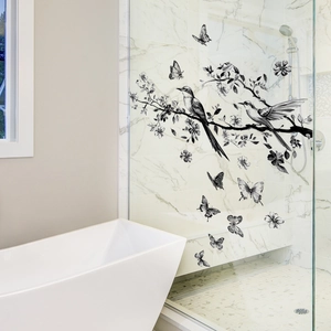 Ink style bird and butterfly glass window decal on a modern shower door partition