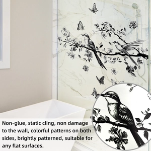Detail view of black ink-style bird and flower static cling decal on bathroom glass
