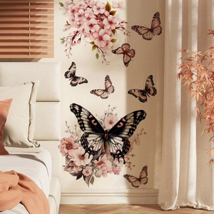 Detail of floral butterfly wall stickers with pink cherry blossoms on bedroom wall
