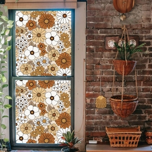 Detail of vintage floral static window film with retro daisies on a glass sliding door