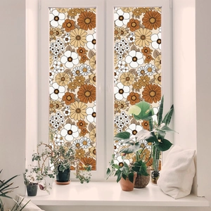 Detailed view of vintage daisy floral window film applied to home glass for privacy
