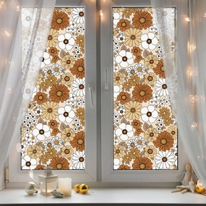 Vintage floral window film with daisy patterns on a glass pane in a cozy home setting