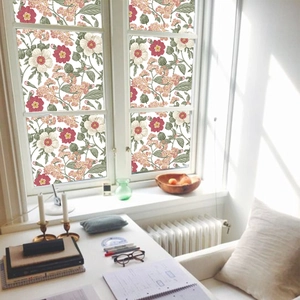 Floral frosted window film providing privacy and natural light in a Nordic home office
