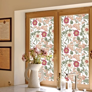 Floral window privacy film with pink flowers and green leaves on glass window