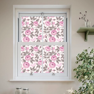 Close-up of static cling window film with pink roses, grey leaves and butterfly patterns