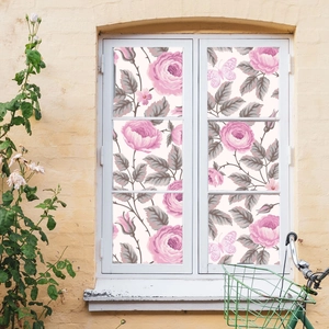 Self-adhesive floral window film with pink roses and butterflies on white glass