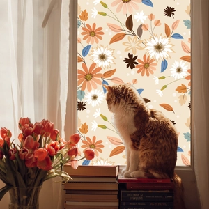 Detailed view of floral window film showing privacy protection and warm botanical patterns