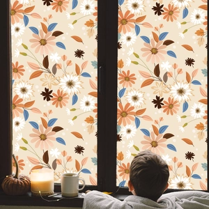 Floral window privacy film showing vintage flower patterns in a cozy autumn home setting