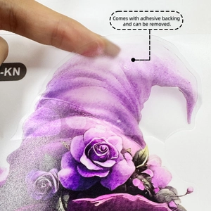 Detail of self-adhesive purple witch hat toilet sticker showing the removable adhesive backing