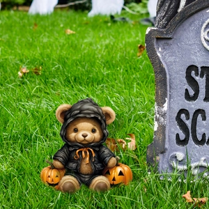 Halloween garden decor set with teddy bear in black hooded cape and mini pumpkin lights