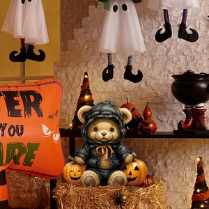 Detailed Halloween scene featuring a 3D teddy bear with jack-o-lanterns and festive props