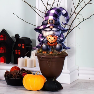 Halloween gnome stake with purple plaid hat and orange pumpkin lamp in festive scene