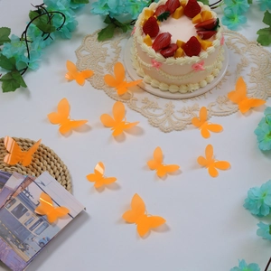 Set of 12 vibrant orange 3D butterfly wall stickers for party and cake decorations