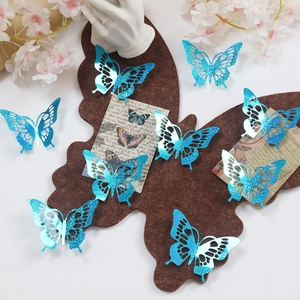 Detail of 3D blue glitter laser cut butterfly wall stickers in a decorative setup