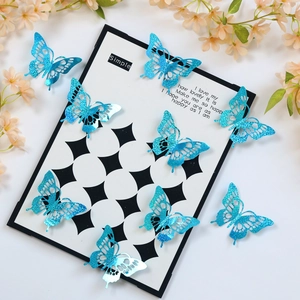 Detail of 3D blue glitter hollow-out butterfly wall stickers on decorative background