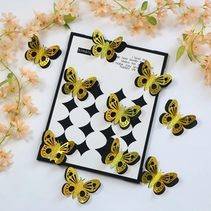 Detail of 3D yellow butterflies with glitter texture and hollow wings on a white background