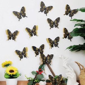 Detail of 3D black and gold double-layer butterfly wall stickers in a home decor setting