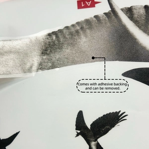 Detail of bird and mountain wall sticker showing its adhesive backing and texture
