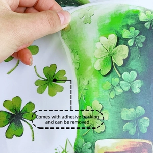 Detail showing hand peeling a green shamrock sticker with adhesive backing