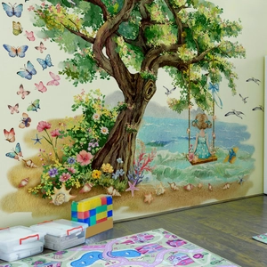 Kids wall decal featuring a large tree and girl swinging in a beach nature scene