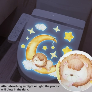 Glow-in-the-dark sleeping lion wall sticker showing luminous blue light in dark bathroom
