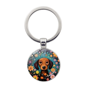 Detail of dachshund dog keychain with glass cabochon and colorful floral art design