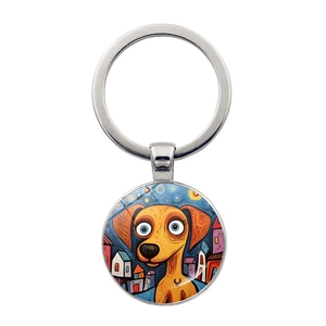 Macro view of a silver metal keychain with a colorful pop-art puppy illustration charm