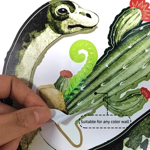 Macro view of dinosaur wall sticker edge showing self-adhesive PVC layer and white backing
