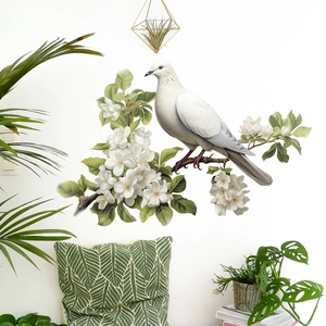 Realistic wall sticker with white bird on blooming branches and green leaves detail