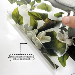 Detail showing self-adhesive backing of bird and branch wall stickers for easy removal