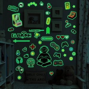 Luminous video game wall decals for kids room featuring gamepads and pixel icons
