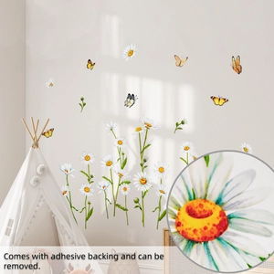 Detail of self-adhesive daisy and yellow butterfly wall stickers for bedroom decor