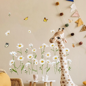 Detailed view of 3D daisy and butterfly wall decals in a warm nursery setting