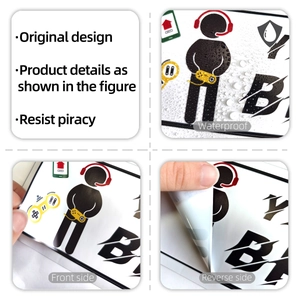 Detail view of waterproof gaming stickers showing front graphics and adhesive back