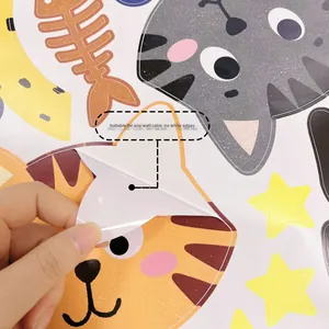 Detail showing transparent cartoon cat wall sticker being peeled with no white borders