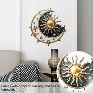 Detail showing the sun and moon wall sticker with adhesive backing on a modern wall