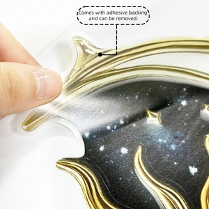 Detail of self-adhesive galaxy wall sticker showing the easy-to-peel removable backing