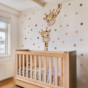 Cartoon watercolor giraffe wall decals with polka dots for a minimalist nursery wall decor