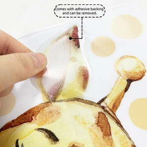 Close-up of watercolor giraffe wall sticker showing self-adhesive backing and easy removal