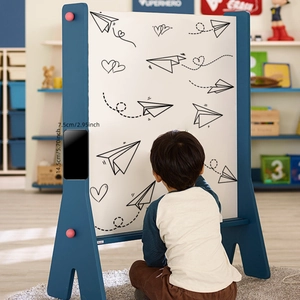 Blue wooden children's drawing board with heart and paper plane patterns on stand