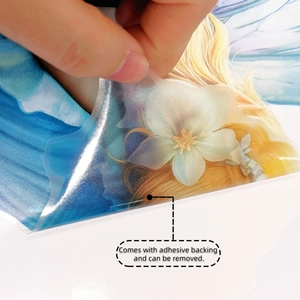 Close-up of blue fairy wall sticker showing adhesive backing and easy removal process