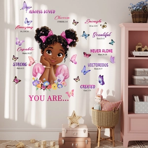 Detail of inspirational girl wall decals with floral butterfly patterns and pink bow accents