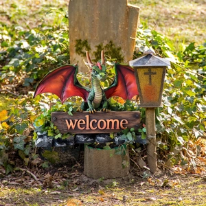 Detail of creative green dragon welcome sign with retro lamp post garden stake